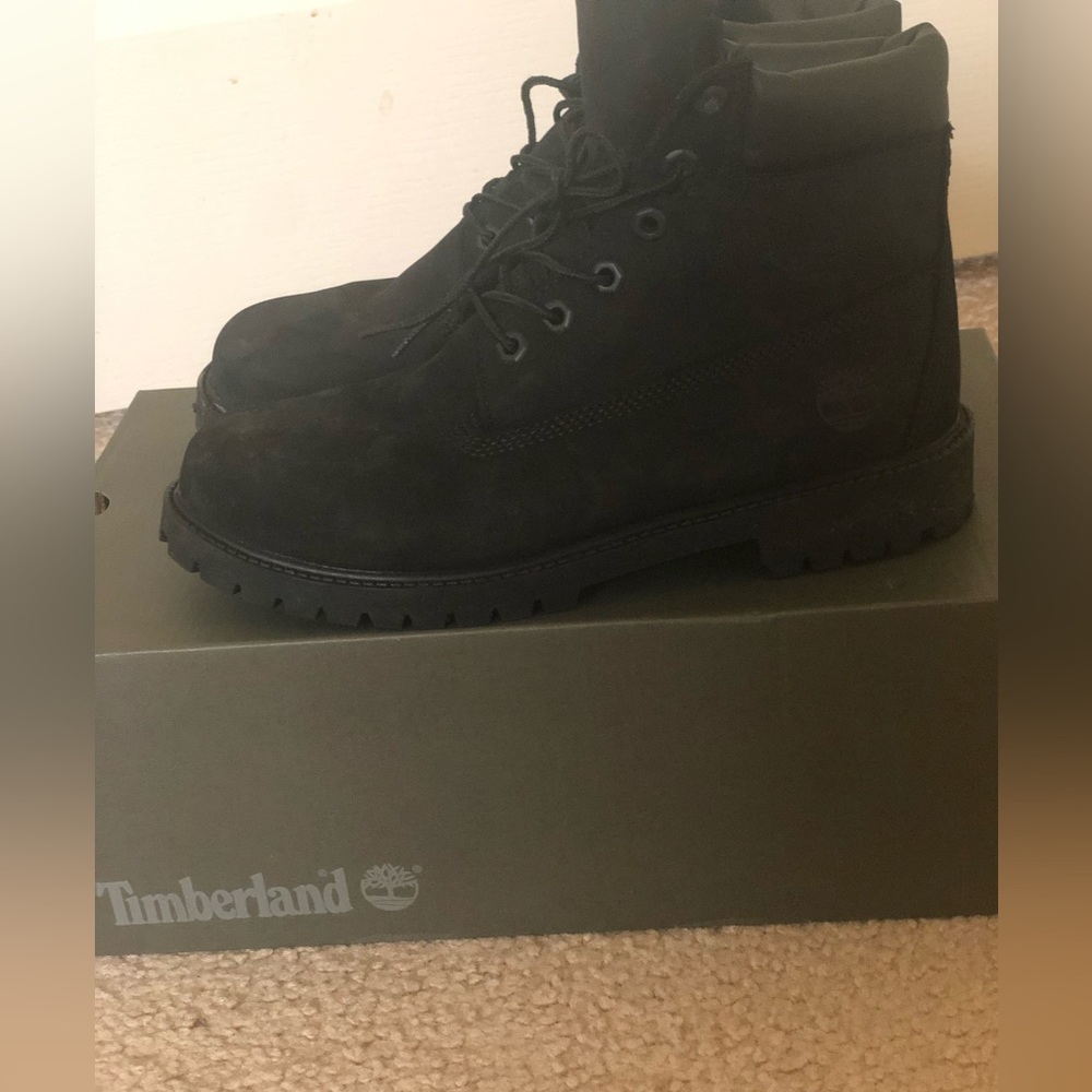Black size 7 big kid Timberland Boot.